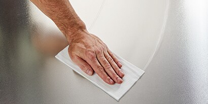 Degreaser wipe being used on a surface
