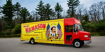 Delivery van covered fully covered in 3M graphic wrap with images of food on the side and back
