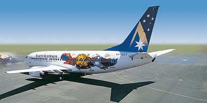 An aircraft on the runway wrapped in a  colorful animal 3M graphic wrap and a blue 3M graphic wrap with stars on the tail of the aircraft.
