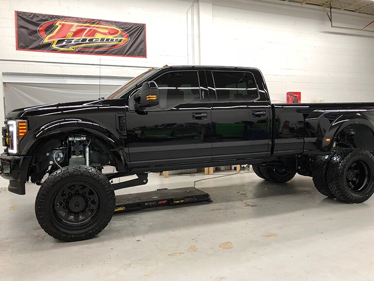 black car covered with 3M paint protection film
