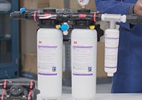 3M™ High Flow Series Multi-Equipment Filtration System Model DP290 cartridges remain in place.
