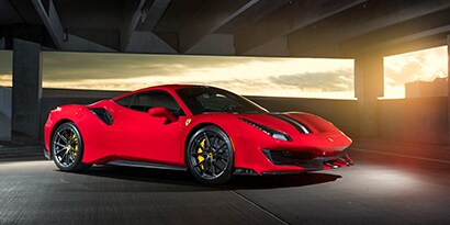 A sports car with red 3M™ Wrap Film.
