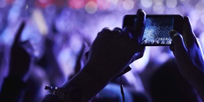 Phone streaming video at a concert.
