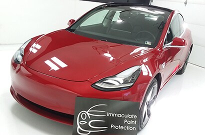 red car covered with 3M paint protection film
