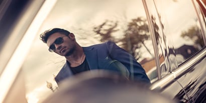 man reflected in window film
