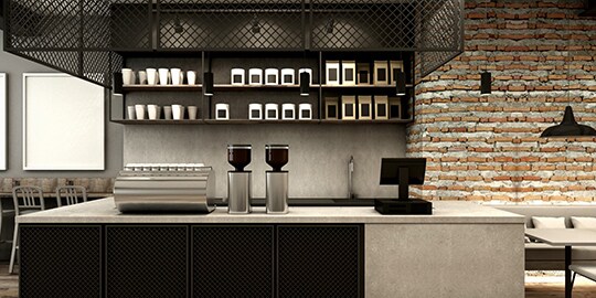 Modern commercial kitchen counter with open shelves.
