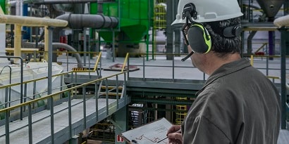 Worker wearing two-way radio headset
