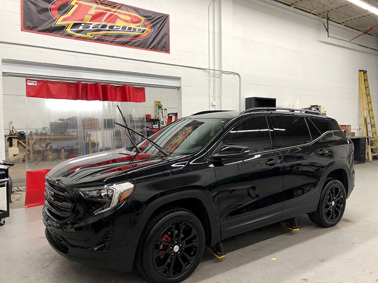 black car covered with 3M paint protection film
