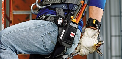 Image of worker wearing a wristband anchor attached to a wrench
